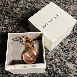 Micheal Kors rose gold plated watch, with tag. New, never worn.